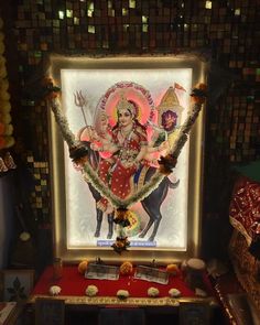 an idol is displayed in the corner of a room