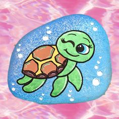 a painted rock with a turtle on it