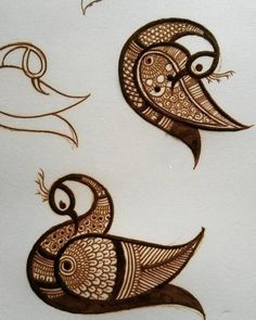 two birds with different designs on their bodies