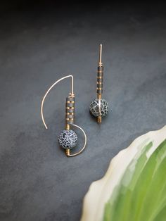 "These dramatic drop earrings have a fun modern feel with an Art Deco twist. Made from 14K yellow gold filled wire, tiny hematite beads and geometric matte black cracked agate beads. The wire has portions that are hammered to give the earring a unique combo of texture and smooth. Earring length: 1 5/8\" Note: These earrings are made to order. These can be made in yellow or rose gold fill or in sterling silver wire. I need 5-7 days to create depending on my work load." Artistic Black Jewelry With Matching Earrings, Artistic Black Drop Earrings, Artistic Black Dangle Jewelry, Artisan Black Jewelry With Ear Wire, Artistic Black Dangle Earrings, Artisan Black Dangle Earrings, Black Artisan Earrings, Unique Black Pierced Earrings, Unique Black Dangle Plug Earrings