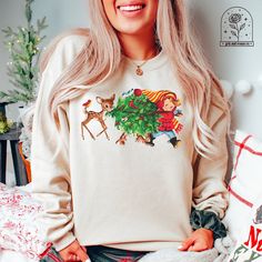 Vintage Christmas Tree Christmas Sweatshirt Cute Retro Christmas Sweatshirts Christmas Pajamas Tees and Hoodies Christmas Shirt Christmas Tshirts ALL OF OUR ITEMS CAN BE MADE IN YOUTH SIZES, TSHIRTS (COMFORT COLORS AND BELLA CANVAS), SWEATSHIRTS AND HOODIES AND IN OTHER COLORS THAN LISTED USUALLY. IF THERE IS A DESIGN YOU WOULD LIKE IN A DIFFERENT OPTION JUST ASK AND WE WILL ADD IT FOR YOU PLEASE NOTE: These sweatshirts are unisex and fit true to size! If you prefer an oversized fit, be sure to Christmas Cotton Sweatshirt For Loungewear, Sweatshirt Cute, Vintage Christmas Tree, Tree Christmas, Christmas Pajamas, Retro Christmas, Christmas Shirt, Christmas Sweatshirts, Christmas Tshirts