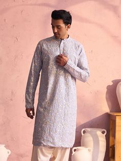 SHRESTHA By VASTRAMAY Men's Sky Blue Georgette Floral Motif Embroidered Kurta A masterpiece in ethnic fashion, this sky blue georgette kurta from SHRESTHA By VASTRAMAY, is a must-have in your wardrobe. It features exquisite floral motif embroidery that adds to its charm. Crafted from georgette fabric, this kurta ensures comfort and style. Features: Color: Sky Blue Fabric: Georgette Design: Floral Motif Embroidery Style: Kurta Specifications: Brand: SHRESTHA By VASTRAMAY Fit: Regular Neck: Mandar Sky Blue Fabric, Embroidered Top Designs, Georgette Kurta, Motif Embroidery, Sleeves Top, Georgette Fabric, Hot Outfits, Full Sleeves, Packaging Labels