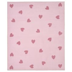 a pink rug with hearts on it