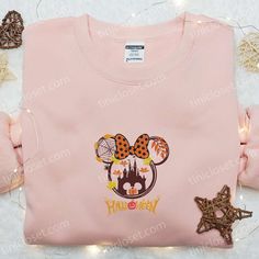 Minnie Halloween Fall Pumpkin Embroidered Sweatshirt, Disney Halloween Embroidered Sweatshirt, Best Halloween Gift Ideas Nestled within the vibrant tapestry of fashion, Tinicloset stands as an emporium of personalized style, where every garment becomes a canvas for self-expression and individuality. Our boutique proudly presents a captivating collection of custom embroidered attire, weaving threads of sophistication and charm into every stitch. At the heart of our cherished assortment rests an e Disney Graphic Print Sweatshirt For Fall, Disney Long Sleeve Halloween Sweatshirt, Halloween Gift Ideas, Halloween Fall, Embroidered Sweatshirt, Embroidered Hoodie, Disney Halloween, Embroidered Sweatshirts, Disney Cartoons