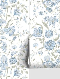 blue flowers and leaves on white wallpaper next to a large piece of paper with the same pattern