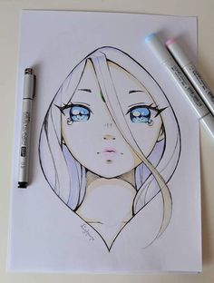 a drawing of a woman's face with blue eyes and blonde hair, next to two markers