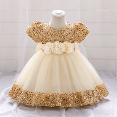 Be the star of the party with our Big Bow Gold Sequins Party Dress! This glitzy and elegant dress features a stunning gold sequin design with a playful bow and delicate lace tutu. Perfect for first birthdays, weddings, proms, or Christmas events. Crown your little princess with this dress and watch her shine! Material: White Baptism Dress, Girls First Communion Dresses, Birthday Princess Dress, Girls Baptism Dress, 1st Birthday Dresses, Toddler Tutu, Baptism Dress, Birthday Princess, Christening Dress