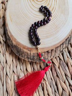 ✔️ 8 mm round cut garnet stone beads with Red tassel and Evil Eye charm ✔️ Natural Color Women tesbih ✔️ High Grade Natural Garnet Stone Tasbih ✔️ This glamorous tasbih is a very special gift for your loved ones. ✔️ Each order comes in a special box. ✔️ PLEASE CLICK THE LINK FOR ALL PRAYER BEADS MODELS https://www.etsy.com/shop/GoodJewelsofYazmasal Note: As a natural feature the stones beads may have some variations. SHIPPING: United States (Standart/DHL eCommerce/usps): 7-10 business days Unite 8mm Oval Beads For Gifts, Red 8mm Spiritual Beads, Red Gemstone Beads Mala As Gift, Red Mala With Gemstone Beads As Gift, Red Round Beads Mala For Gift, Red 8mm Beads Spiritual Mala, Red Round Beads Mala As Gift, Red Mala With Round Beads For Gift, Red Carnelian Beads For Gift