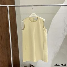 Olivia Mark - Sleeveless Casual Midi Dress with Minimalist Design Minimalist Sleeveless Dresses For Workwear, Minimalist Sleeveless Dress For Work, Sleeveless Mini Dress For Summer Workwear, Solid Sheath Sleeveless Dress For Summer, Solid Color Spring Sleeveless Dress, Casual Sleeveless Dress For Work, Sleeveless Mini Dress For Work In Spring, Lemon Color, Casual Midi Dress