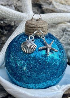 a blue ornament with a starfish on it