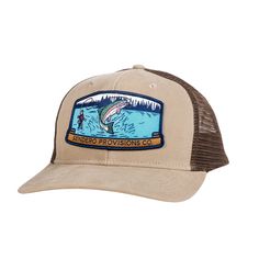 a brown and tan trucker hat with an image of a man surfing on the water