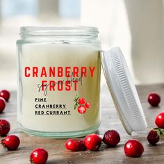 cranberry frost candle surrounded by berries