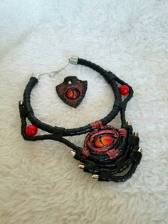 This is a unique necklace crafted from genuine leather, painted with acrylics, hand-painted dragon-eye stylized glass eye and natural stone coral, this unique necklace will protect you from ill will and will give you compliments from anyone who sees it. To see more of my products visit my page in Instagram https://www.instagram.com/mariyana.sobol Halloween Dragon, Magic Amulet, Painted Dragon, Personalised Leather Journals, Enchanted Jewelry, Leather Journal Cover, Dragon Eye, Necklace Craft, Unique Necklace