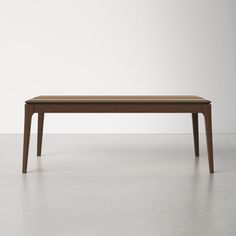 a wooden table sitting on top of a white floor