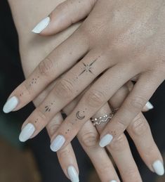 two hands with different designs on them and one has a star, moon and crescent tattoo