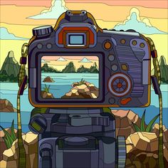 a digital camera sitting on top of a rock next to a body of water with mountains in the background