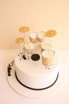 a white cake with musical instruments on top