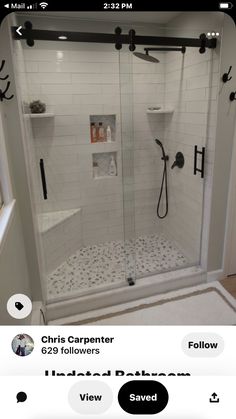 a bathroom with a walk in shower next to a toilet