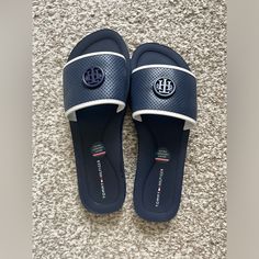 New Tommy Hilfiger Navy Monogram Logo Slip On Sandals Brand New With Tag. Size: 7. Super Comfortable! Tommy Hilfiger Slip-on Beach Sandals, Tommy Hilfiger Cushioned Slip-on Sandals, Tommy Hilfiger Flat Sandals With Cushioned Footbed, Tommy Hilfiger Synthetic Beach Sandals, Tommy Hilfiger Casual Open Toe Sandals, Navy Open Toe Sandals With Cushioned Footbed, Navy Sandals With Branded Insole For The Beach, Tommy Hilfiger Flat Sandals, Navy Cushioned Open Toe Slides