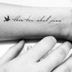 a person's arm with a bird on it that says, this too shall pass