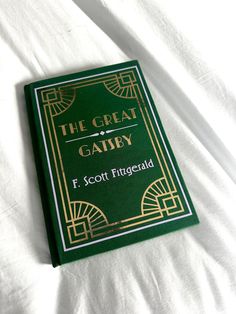 This handmade special edition of The Great Gatsby features emerald, gold, and lilac accents. The Great Gatsby Book Cover, Sam Pauly, The Great Gatsby Book, Gatsby Book, Jordan Baker, Book Handmade, The Great, The Great Gatsby, Great Gatsby