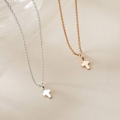 A timeless classic to treasure each day, our Mini Cross Charm Necklace is perfect for commemorating those special moments. Gift to a loved one or cherish your new favorite necklace in either 18K Champagne Gold Plated or 925 Sterling Silver.&nbsp;18K Champagne Gold Plated or 925 Sterling SilverMini Cross: 0.3 x 0.2Charms are removable from this chain and can be worn on all Merci Maman chain lengthsSent with love in a complimentary gift box Gold Sterling Silver Fine Jewelry Necklaces, Dainty Sterling Silver Necklace In Yellow Gold, 14k Gold Clavicle Chain Necklace With Cross Pendant, 14k Gold Clavicle Chain With Cross Pendant, Silver Custom Necklace In Dainty Style, 14k Gold Spiritual Cross Pendant Necklace, Dainty 14k Gold Necklace In Silver Color, Dainty 14k Gold Custom Necklace In Silver, Everyday Gold Plated Cross Pendant Necklace