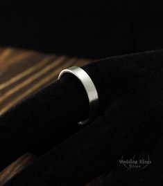 4mm simple silver wedding band in matte finish, Men's or women's wedding ring, Silver matte ring, Sterling silver plain band, Flat wedding ring. ■ All wedding rings are only crafted with the finest of recycled metals DETAILS: Metal - Sterling Silver Dimensions - width 4mm (0.157 in.), thickness 1,3mm (0.05 in.) Finish - matte (shiny at your request) Please choose your ring size and finish in menu while making your order View similar ring with diamond: https://www.etsy.com/listing/520244594 ■ CUS Minimalist Wedding Bands With Smooth Finish, Minimalist Brushed Finish Promise Ring, Minimalist Rings With Brushed Finish For Anniversary, Silver Wedding Rings With Brushed Finish, Minimalist Silver Wedding Ring, Flat Wedding Ring, Wedding Ring Silver, Flat Ring, Silver Wedding Band