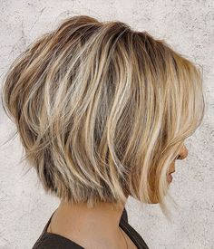 Stacked short haircut with razored ends, showcasing textured layers and a chic, modern look Defined Layers, Textured Haircut