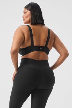 Designed with bonded edges for a seamless fit that molds perfectly to your body, the Strength Bra is straight-up sleek. It’s supportive, too, with hook-and-eye closures in back, a snug underbust band, and adjustable tank straps that can be worn crisscrossed or straight. Pair it with the matching Strength Leggings to make a set you’ll reach for constantly. Black Shapewear With Built-in Bra For Sports, Fitted Full Coverage Sports Bra With Built-in Padding, Black Full Coverage Sports Bra With Built-in Bra, Workout Shapewear With Medium Bust Support, Black Sleek Shapewear With Built-in Bra, Compressive Bra With Built-in Padding, Black Stretch Bra With Built-in Padding, Compressive Shapewear Bra With Removable Pads, Fitted Alo Yoga Sports Bra With Built-in Bra