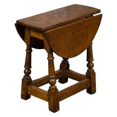 an old wooden table with two legs and a drawer on the top, sitting against a white background