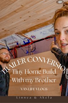 a woman talking on a cell phone while standing next to a man in a garage