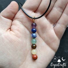 This natural Chakra stone drop pendant necklace is perfect for balancing and recharging your chakras. This necklace features 7 natural stones to represent each chakra (amethyst, lapis lazuli, sodalite, green aventurine, tigers eye, yellow Jade, and red Jasper) Pendant is hung on wax coated thread with a lobster claw clasp closure. Lapis Lazuli Crystal Necklaces For Jewelry Making, Lapis Lazuli Crystal Necklace For Jewelry Making, Spiritual Multicolor Pendant Charm Necklaces, Spiritual Gemstone Pendant Beads, Multicolor Spiritual Charm Necklaces For Gift, Healing Birthstone Necklaces With Round Beads, Healing Birthstone Necklace With Round Beads, Gemstone Pendant Charm Necklace For Meditation, Rainbow Spiritual Pendant Jewelry