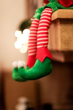 an elf's legs hanging from the ceiling