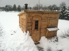 an outhouse in the middle of some snow