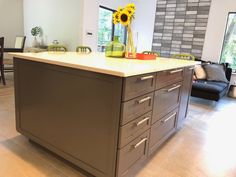 a kitchen island with sunflowers on it