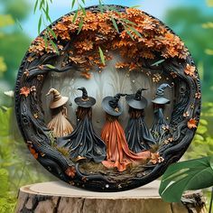 an image of three witches in the woods on a tree stump with leaves around them