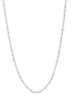 Add sophisticated shine to your layered look with this disc station necklace crafted from sterling silver. Sterling silver Imported Silver Satellite Chain Necklace For Everyday, Silver Sterling Station Necklace For Gift, Silver Sterling Beaded Chain Necklace, Everyday Silver Sterling Silver Layered Necklace, Silver Sterling Silver Station Necklace Gift, White Gold Sterling Silver Necklaces With Satellite Chain, Sterling Silver Beaded Chain Necklace, Classic White Gold Satellite Chain Necklace, Silver Necklaces With Beaded Chain For Layering