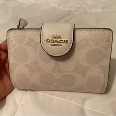 Almost Completely Brand New. I’ve Used It A Couple Times And Now It Just Sits In A Purse I Don’t Use, It’s Still In Great Condition. White Coach Wallet, Cute Coach Wallet, White Travel Wallet With Removable Pouch, Beige Pouch Wallet With Interior Card Slots, Elegant White Coin Purse With Interior Card Slots, Chic White Wallet For Everyday Use, Chic White Wallets For Everyday Use, Elegant White Coin Purse With Card Slots, Cream Coin Purse For Daily Use