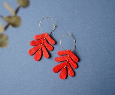 "Leather Hoop earrings in the soft shape of an Oak Leaf - this listing is for these earrings in CHILI, although we offer several other colour options. See \"Collections\" for more options. We're also now offering these options with a \"Hooks\" option. Select Hoops or Hooks from the drop-down menu (the earrings are pictured on the model in Hoops) FEATURES * * * * Made from scraps of reclaimed leather, salvaged from discarded material, and painted by hand with high-quality leather paints. * The Ho Red Oak Leaf, Leather Hoop Earrings, Oak Leaf Earrings, Contemporary Handmade Jewelry, Leather Paint, Oak Leaf, Recycled Leather, Hanging Earrings, Fabric Jewelry