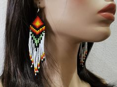 Beautiful and colorful earrings. These eye-catching earrings are made of  seed beads. Silver plated ear wires. Length approximately (including ear wires) - 5 inches (13 cm) Multicolor Bead Cap Drop Earrings, Multicolor Beaded Dangle Earrings With Bead Caps, Multicolor Beaded Dangle Earrings, Multicolor Drop Earrings With Bead Caps, Earrings Native American, Native American Beaded Earrings, Native American Beading, Earrings Beaded, Colorful Earrings