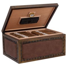 an open wooden box with two cigars in the top and one on the bottom