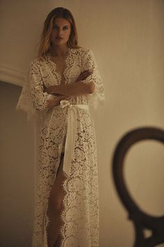 Lace-lined and tied with a silky sash, this romantic robe features delicate flowy sleeves and scalloped trim. | Saskia Long Lace Robe by Homebodii in White, Women's, Size: Medium, Polyester at Anthropologie Bridal Lounge, Bridal Wardrobe, Lace Bridal Robe, Contemporary Bridal, Wedding Wardrobe, Wedding Morning, Anthropologie Wedding, Winter Bride, Perfect Morning