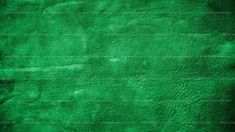 a green textured paper background with some stains on the edges and bottom part of it