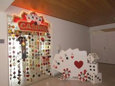 casino themed display with cards and dices in front of the sign that says casino