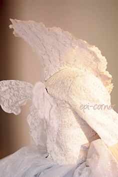 a white dress with angel wings on it