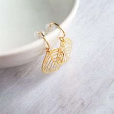 "These are my brand new \"medium size\" version of my smaller gold leaf earrings {shown in last photo} here: https://www.etsy.com/listing/101589592/gold-leaf-earrings-small-delicate-modern Thin polished 18K gold plated leaves in a delicate modern cut-out design. Hung simply on small gold-plated hooks. Lightweight and easy to wear- like they're not even there! These will include little clear rubber stoppers for extra secure wear. Upgrade your HOOKS to 14K SOLID GOLD or 14K gold filled- this can b Leaf Earrings Gold, Leaf Earring, Gold Leaf Earrings, Heirlooms Jewelry, Gold Filigree, Cut Out Design, Delicate Earrings, Modern Earrings, Simple Earrings