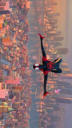 a spider man flying through the air over a city