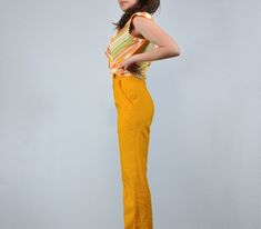 "Show off your sunny side in this bright marigold yellow high waisted pants! 70s striped top available here: https://www.etsy.com/listing/1199212984/ ✈ Measurements ✈ * Taken from SEAM to SEAM with garment lying flat * Waist * 12.25\" (no stretch) Hips * 17.75\" Rise * 12.5\" Inseam * 32.5\" Length * 44\" ✈ Specifics ✈ Label: J.C. Penney Tagged Size: -- Approx. Fit: XXS Color: Marigold Yellow Material: -- (likely cotton) Condition: Good Vintage Condition ✈ Features ✈ * High-waisted cut * Wide wa Yellow Trousers, Stretch Hips, Photo Cutout, Fun Outfits, Marigold Yellow, 80s Outfit, Loose Knit Sweaters, Black Pencil, Dyed Dress