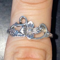 You’re Purchasing A 1x Flower Leaf Aesthetic Ring Design Size 7.50 Sterling Silver 1.3 Grams For Adults/Teens Unisex Pre-Owned 10/10 Good Conditions Heavy Wedding Vintage Collectible Limited Exclusive Available! Ask Me Anythig Open To Offers! Adjustable Silver Vintage Midi Rings, Delicate Silver Ring For Spring, Vintage Silver Toe Ring With Flower Design, Silver Sterling Silver Flower Ring For Spring, Spring Sterling Silver Flower Ring In Silver, Silver Open Flower Ring For Spring, Silver Hypoallergenic Flower Ring For Promise, Spring Silver Sterling Silver Flower Ring, Hypoallergenic Silver Flower Ring For Promise