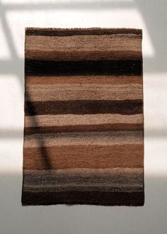 Our small accent rugs are a timeless layer for the home. Use them as a beautiful doormat or as a rug in front of your kitchen or bathroom sink. The Fallin Coconut Handwoven Rug has a palette of umber, cocoa and neutral tones. The rug is tightly woven, perfect for heavy foot traffic. Due to the vintage nature of the rug, some areas may show use. All vintage and antique rugs have been professionally cleaned. One of a kind from the 1960s. Origin: Kars, Turkey Manufacturing: Kilim Material: Wool Con Kars Turkey, Door Mat Entryway, Pine Cone Candles, Vintage Nature, Wall Sculpture Art, Handwoven Rug, Entryway Rug, Earthy Colors, Accent Rugs